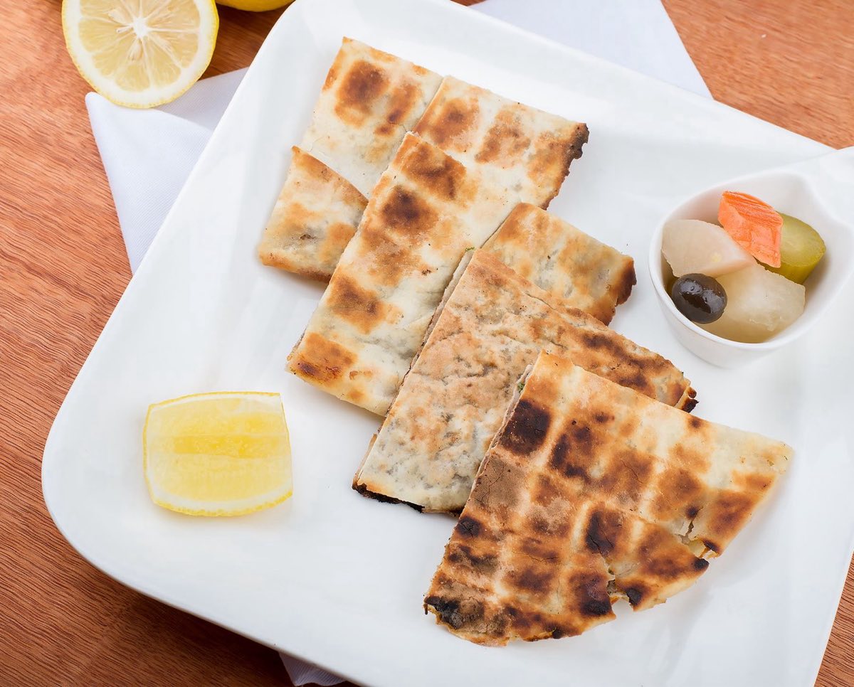 Arayes — Flatbread stuffed generously with a spiced kafta mixture and grilled until the bread crisps and chars while