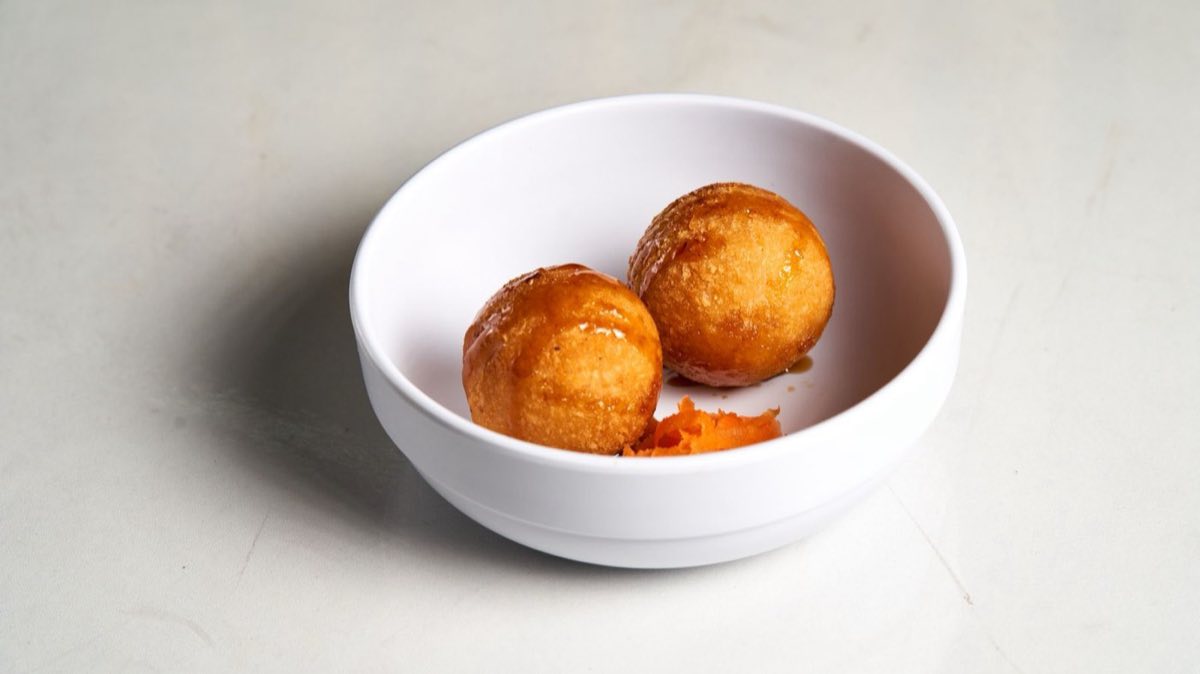 Awamat — Light, crispy fried dough balls soaked in orange blossom syrup
