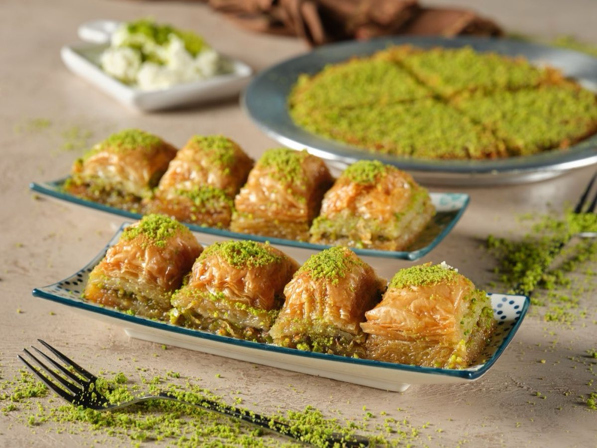 Baklava — Layers of paper-thin phyllo pastry, brushed with clarified butter, filled with spiced nut mixture, and