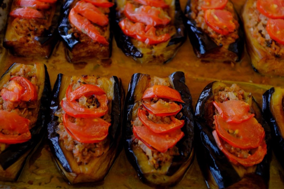 Batinjan bil Lahmeh — Eggplant Braised with Spiced Lamb — Whole small eggplants or large halves, fried until golden and then buried in a spiced lamb-tomato braise
