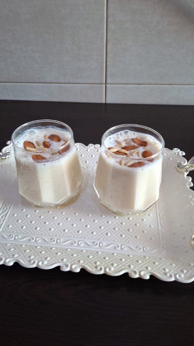 Lebanese Banana Milk Drink — A thick, creamy blended drink made with ripe bananas, cold milk, and crushed pistachios