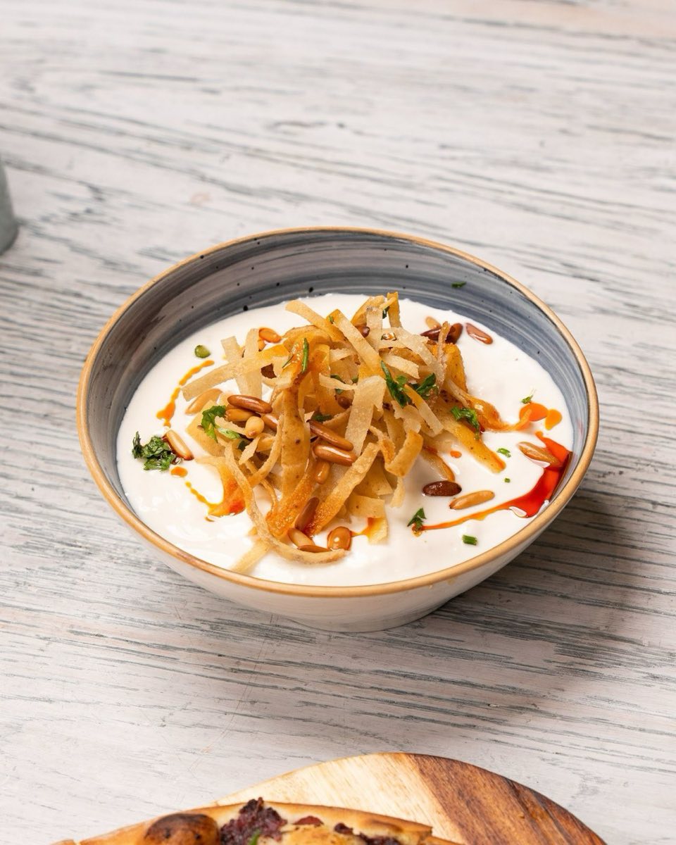 Idlib Layered Chickpea and Yogurt Fatteh — A ceremonial layered dish of shatteringly crisp bread, warm chickpeas in their broth, thick cool yogurt, and