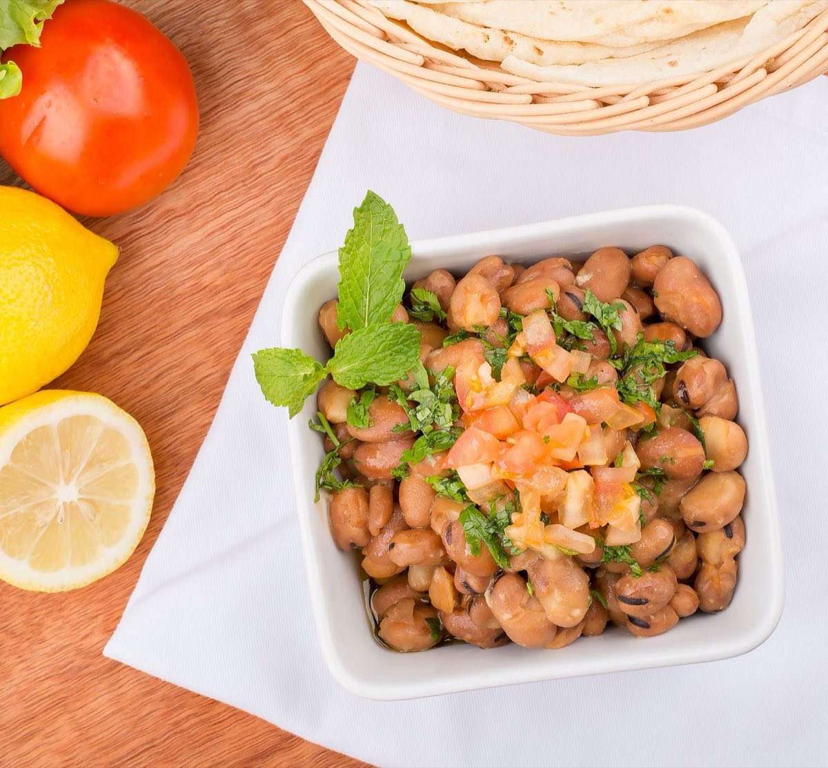 Ful Medames — Slow-cooked fava beans mashed with lemon, garlic, and cumin, then drowned in olive oil