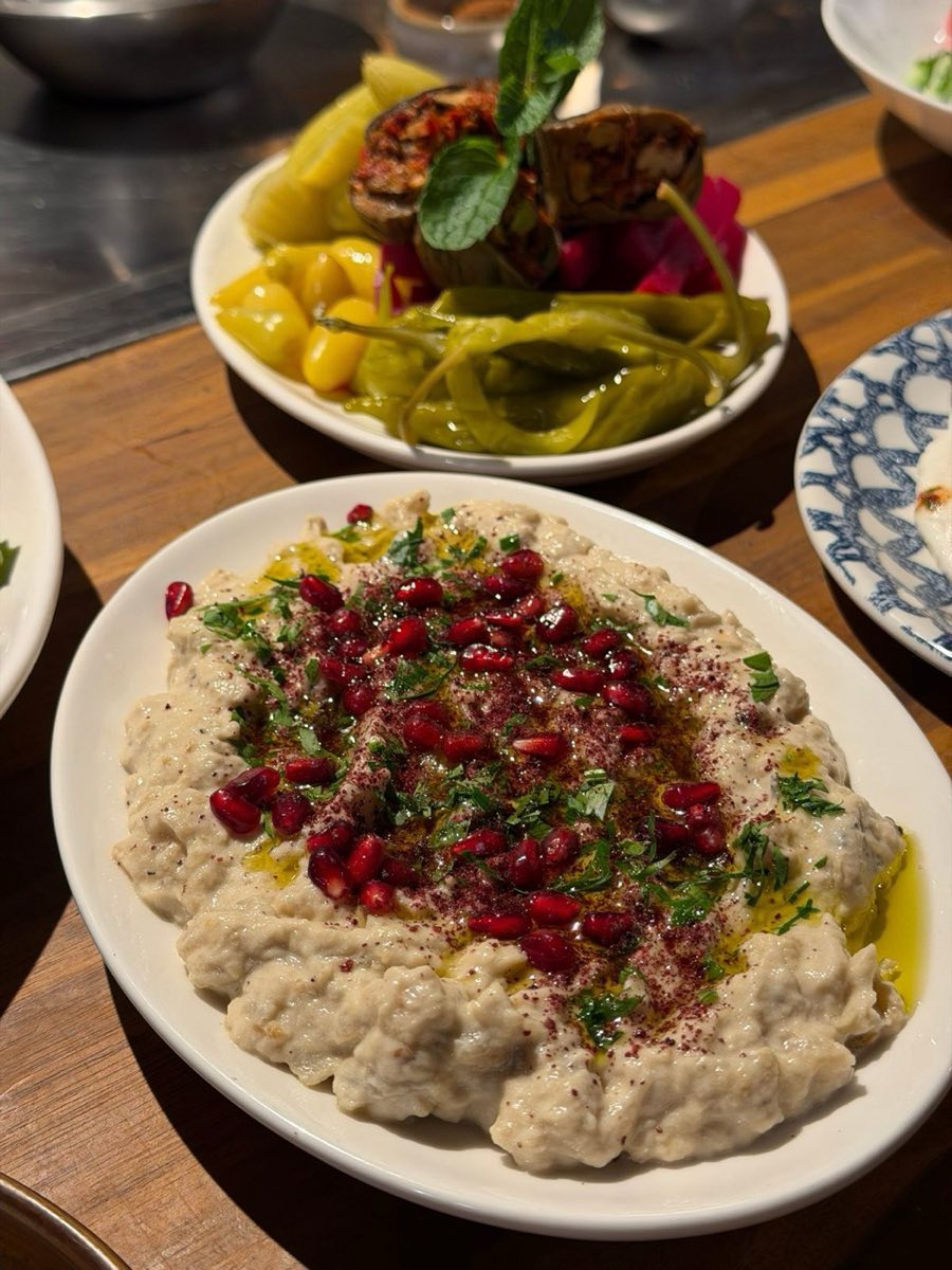 Idlib Smoked Eggplant Dip — Eggplants scorched directly over flame until completely collapsed, then stripped and mashed with fresh