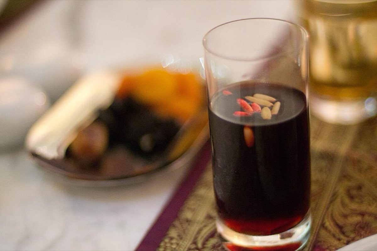 Jallab — The quintessential Lebanese summer drink: dark grape juice and rose water syrup poured over crushed ice