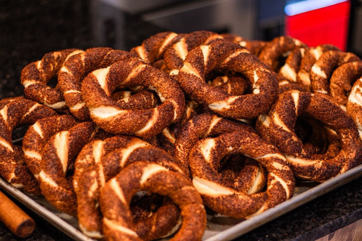 Kaak bi Simsim — The iconic Beirut street bread: oval sesame rings, lightly crisp outside and chewy within, sold by cart
