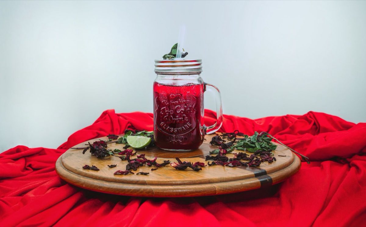 Karakade — Brilliant crimson hibiscus flower tea, served ice-cold and sweetened with a clean simple syrup