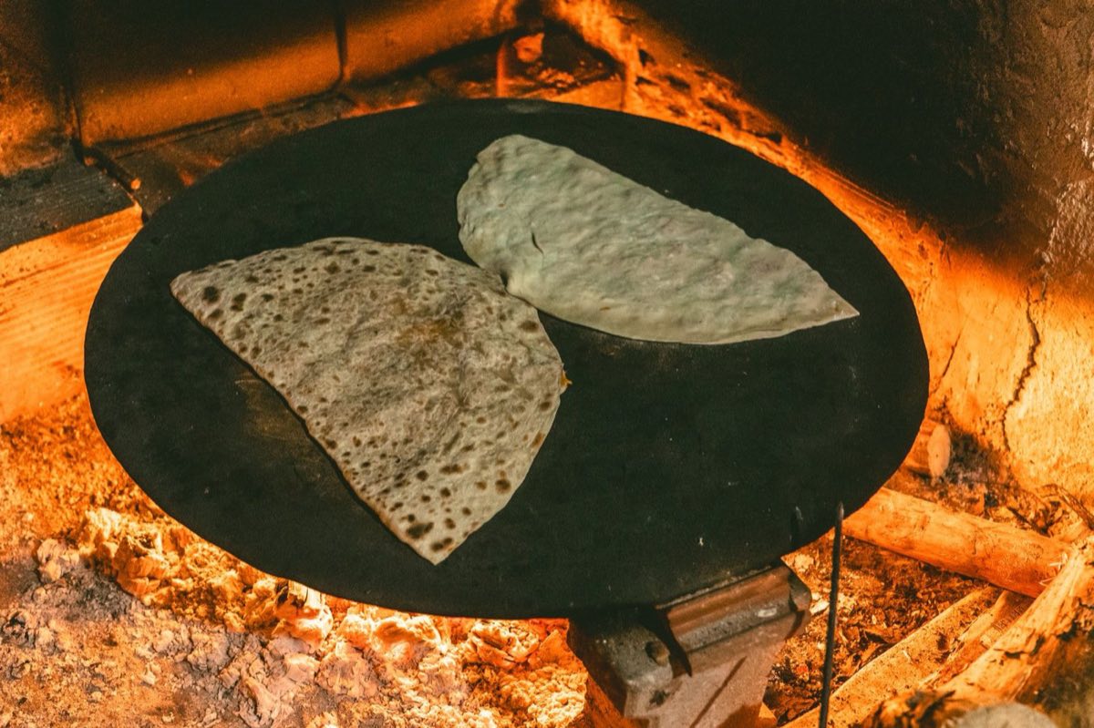 Khubz al Saj — Paper-thin flatbread cooked on a domed iron griddle (saj)