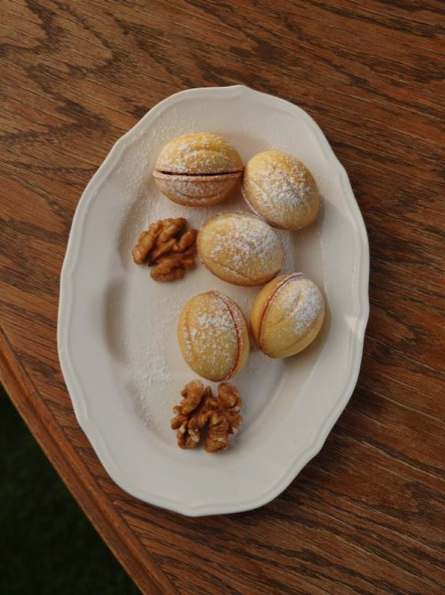 Ma'amoul bil Joz — Tender semolina shells molded in carved wooden molds and filled with a spiced walnut mixture of crushed