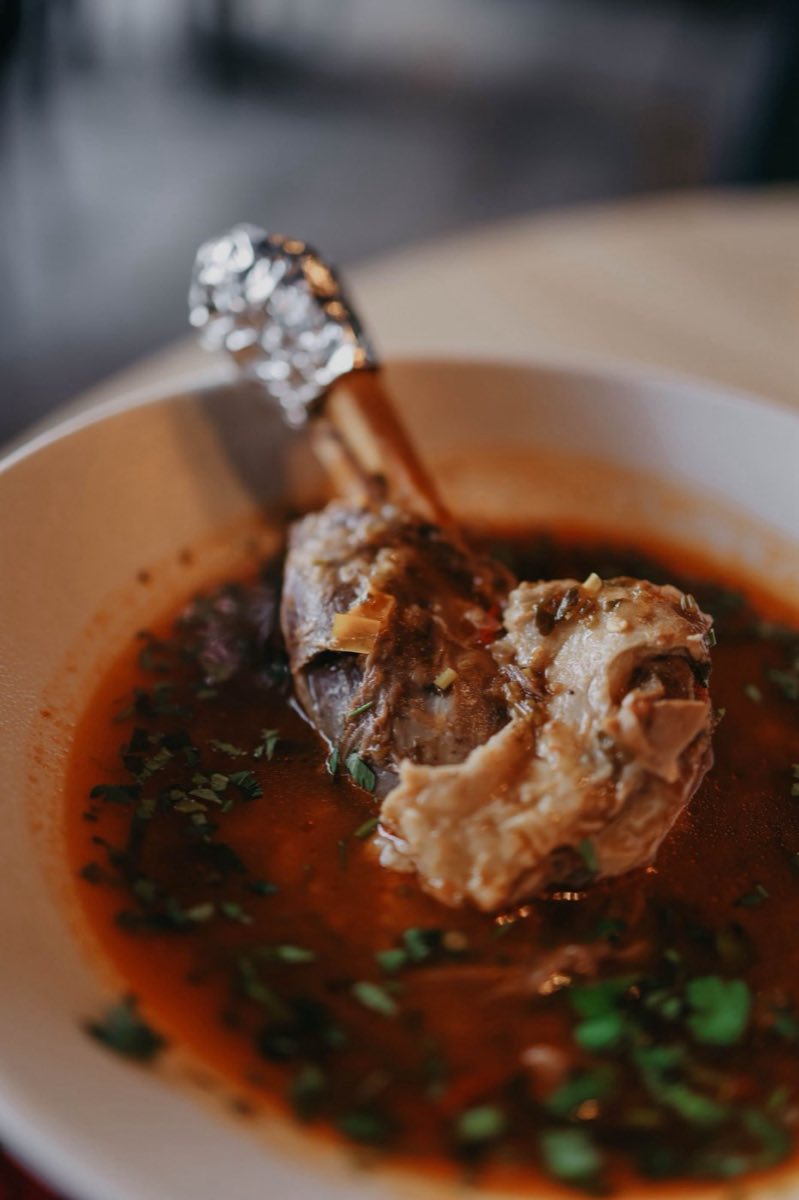 Idlib Slow-Simmered Lamb and Freekeh Broth — A whole-cut lamb slow-simmered for three hours with aromatic vegetables, warm spices, and dried Aleppo chili