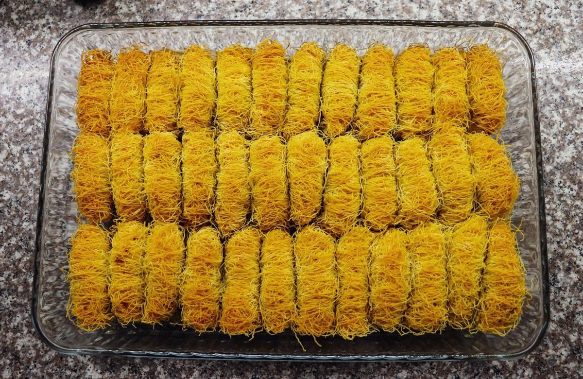 Osmallieh — Crisp golden nests of fine shredded wheat (kataifi pastry) toasted in butter and sugar syrup, filled