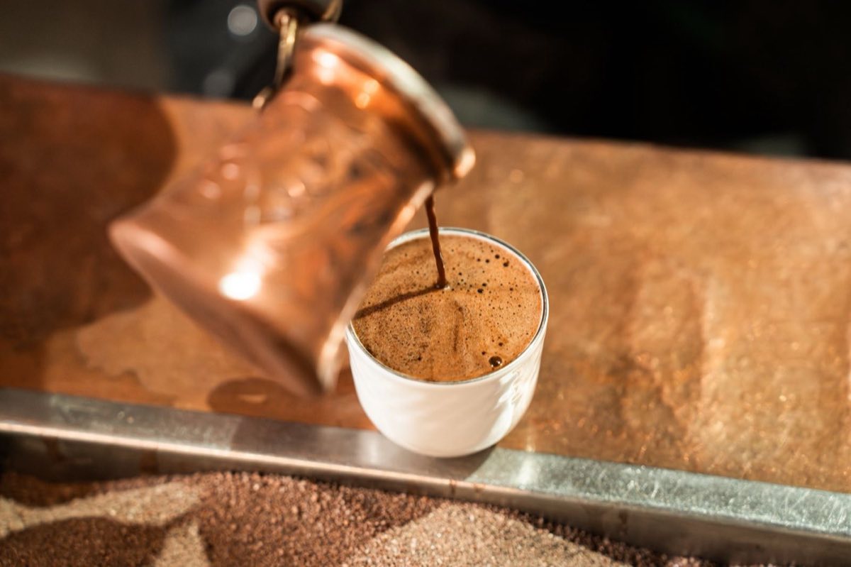 Arabic Coffee — Light, pale-gold coffee brewed with green (unroasted) or lightly roasted beans and cardamom