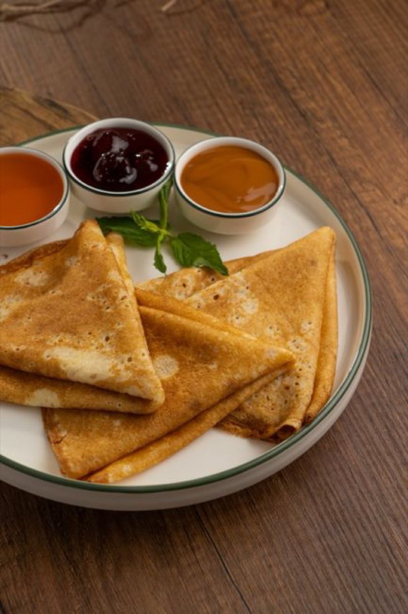 Qatayef — Thick, spongy pancakes folded and stuffed with sweetened ashta cream or walnuts, then fried or baked and