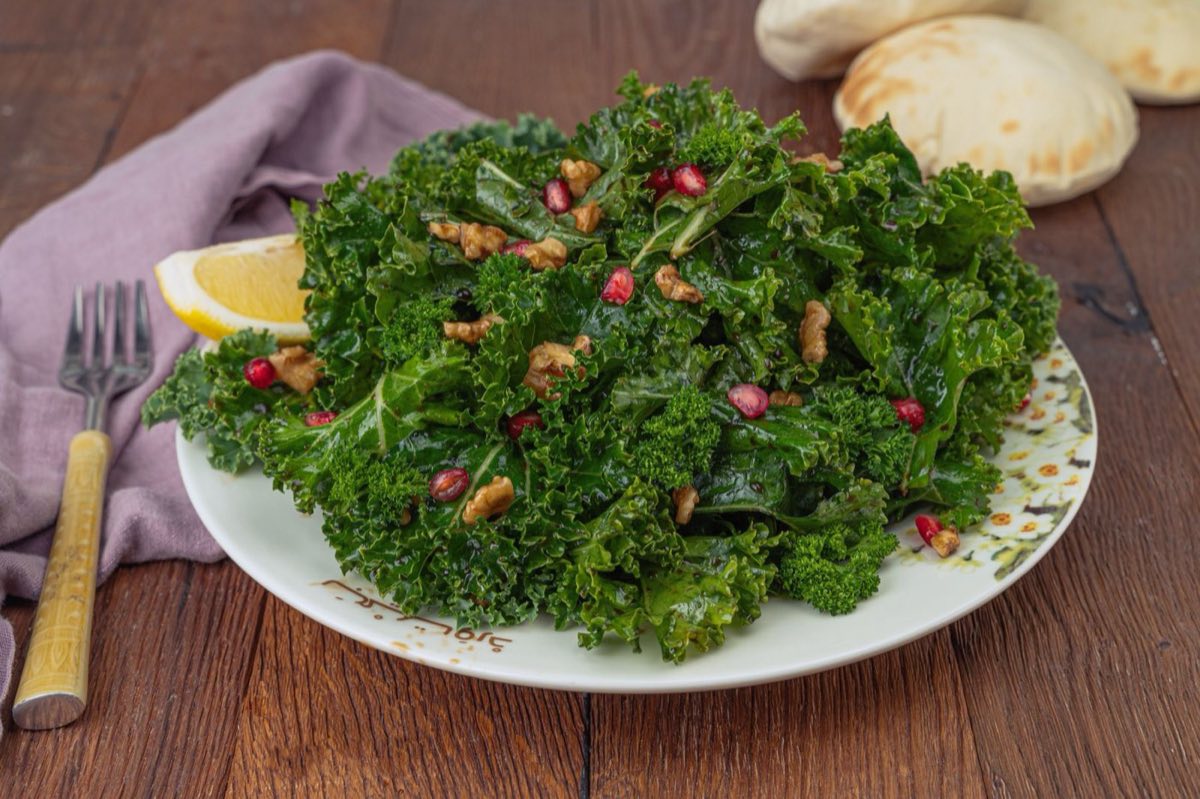 Idlib Pomegranate and Walnut Salad — Brilliant pomegranate arils tossed with crushed walnuts, thinly sliced green onion, fresh mint, Aleppo
