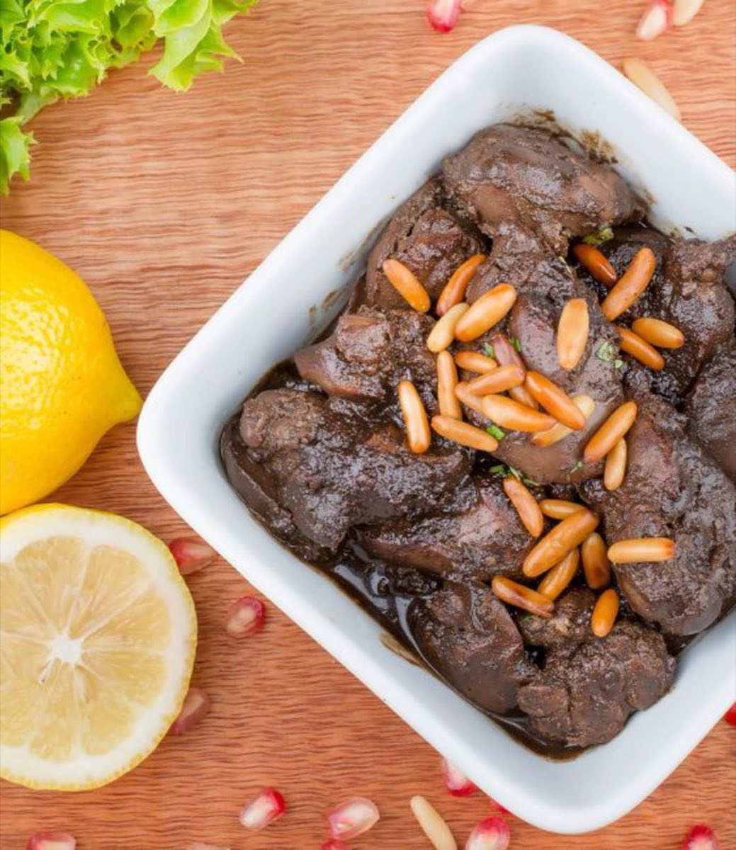 Sawda Djaj — Chicken livers flash-cooked with garlic, a generous pour of pomegranate molasses, and a handful of fresh