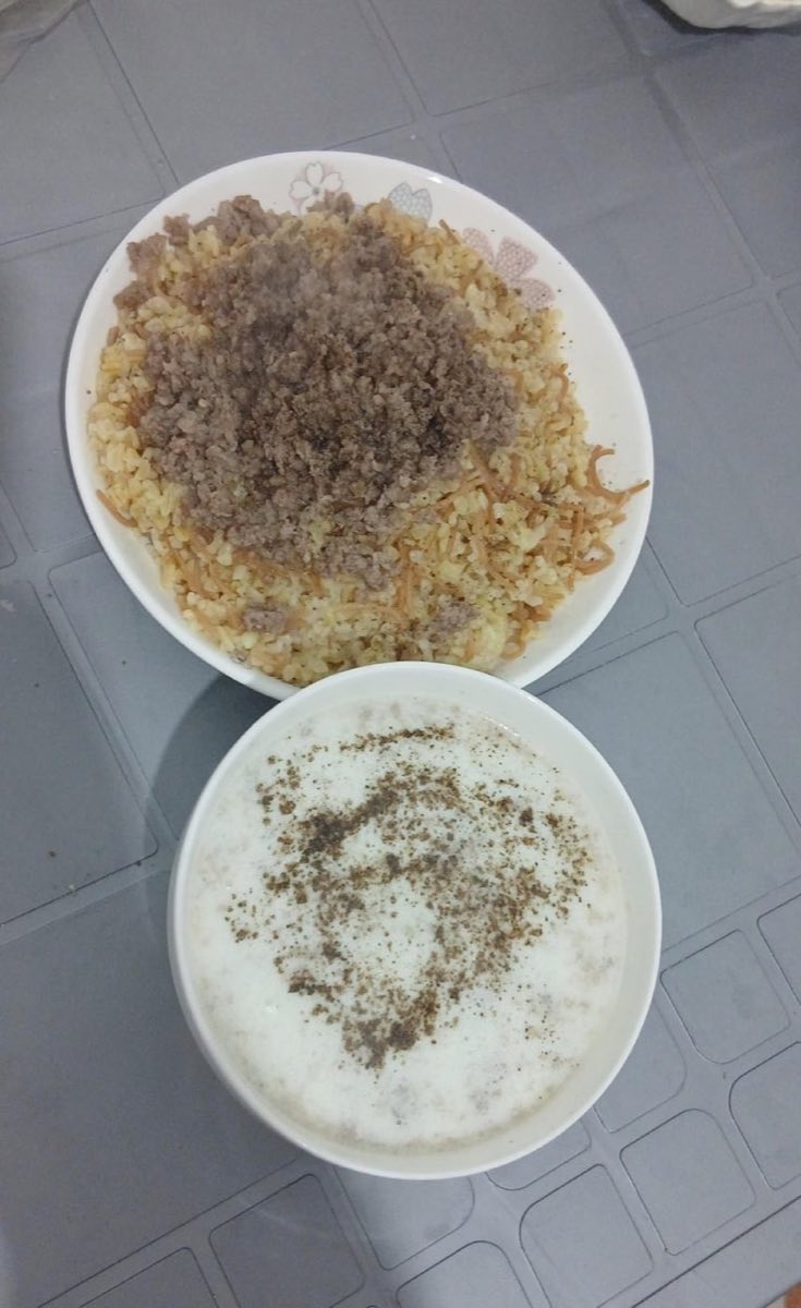Shakriya (Lamb in Yogurt Sauce) — Tender lamb simmered in a stabilized yogurt sauce, served over a base of bulgur wheat and vermicelli toasted