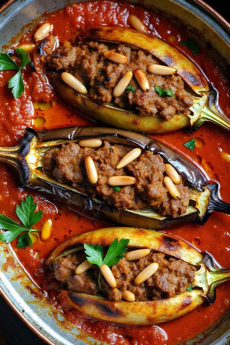 Sheikh Mahshi — Eggplants stuffed with spiced minced lamb and pine nuts, simmered in a rich tomato sauce
