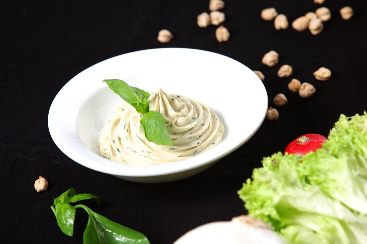 Toum — The Lebanese garlic sauce: a pure white, cloud-light emulsion of garlic, oil, lemon, and salt
